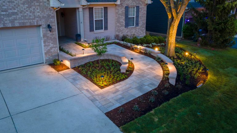 St. Charles modern paver walkway with landscape lighting at night.