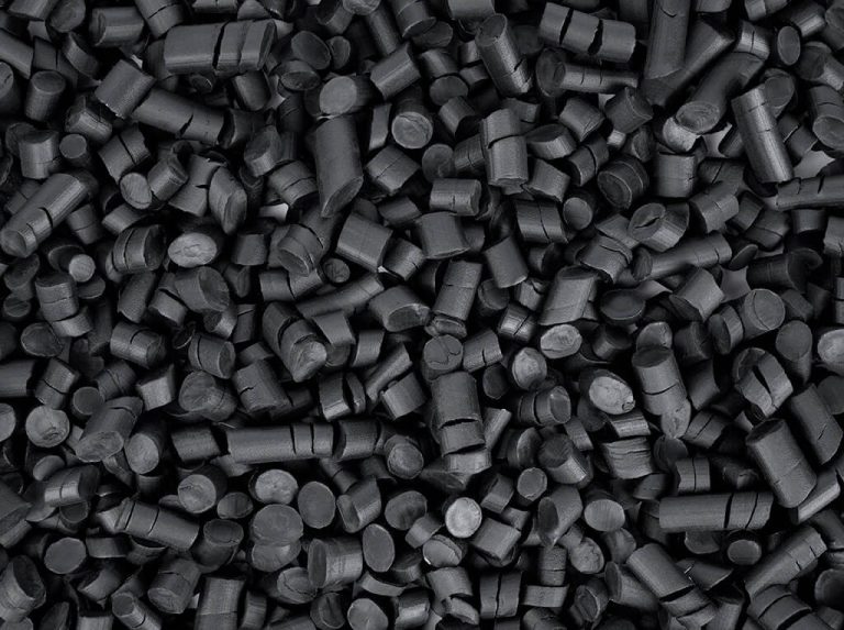 Top-down closeup photo of black rubber granules for mulch
