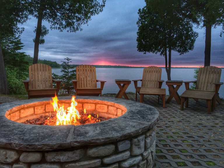 Photo of a brick patio firepit at sunset