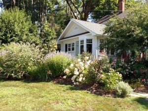 Photo of a landscaped backyard with flowers that could use a renovation